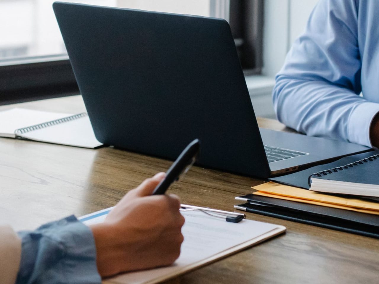 Professionals reviewing documents at an office table
